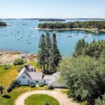 aerial view of the house with the harbor and islands in the background