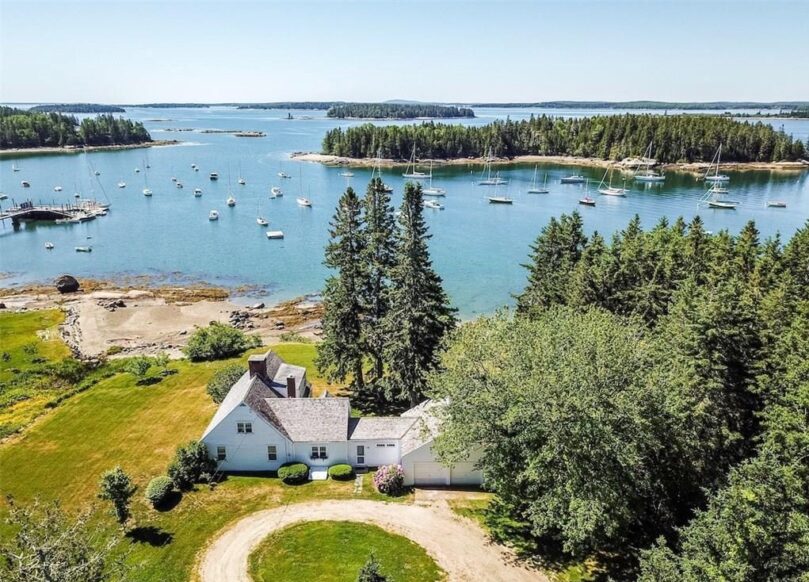 aerial view of the house with the harbor and islands in the background